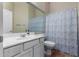 The bathroom features a shower and tub combination with a single sink vanity at 3022 W Redwood Ln, Phoenix, AZ 85045