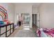 Neutral-toned bedroom featuring a mirrored closet and tile flooring at 3022 W Redwood Ln, Phoenix, AZ 85045