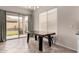 Bright dining area featuring a modern light fixture and sliding doors with backyard views at 3022 W Redwood Ln, Phoenix, AZ 85045