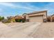 Charming desert home featuring a two-car garage, easy-care landscaping, and a neutral color scheme at 3022 W Redwood Ln, Phoenix, AZ 85045