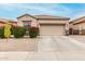 Charming single-story home featuring desert landscaping, a two-car garage, and a neutral color scheme at 3022 W Redwood Ln, Phoenix, AZ 85045