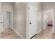 The hallway features tile flooring with doors leading to various rooms at 3022 W Redwood Ln, Phoenix, AZ 85045