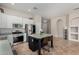 Well-equipped kitchen features a center island, white cabinets, and stainless-steel appliances at 3022 W Redwood Ln, Phoenix, AZ 85045