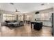 Spacious open-concept area showcasing a living room, dining area, and kitchen with a center island at 3022 W Redwood Ln, Phoenix, AZ 85045