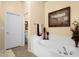 Bright bathroom featuring a soaking tub with tile surround at 3131 E Legacy Dr # 1057, Phoenix, AZ 85042