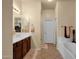 Bright bathroom with dual sinks, wood cabinets, and a separate tub at 3131 E Legacy Dr # 1057, Phoenix, AZ 85042