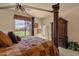 Comfortable bedroom featuring a decorative canopy bed, wardrobe, and window view at 3131 E Legacy Dr # 1057, Phoenix, AZ 85042