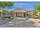 Elegant community clubhouse with stone exterior, manicured gardens, and inviting entrance at 3131 E Legacy Dr # 1057, Phoenix, AZ 85042