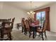 Elegant dining room with chandelier and views of the golf course, perfect for entertaining at 3131 E Legacy Dr # 1057, Phoenix, AZ 85042