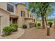 Two story home with low maintenance desert landscaping, walkway, and direct views of the golf course at 3131 E Legacy Dr # 1057, Phoenix, AZ 85042