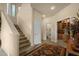 Inviting foyer with staircase, high ceilings, and doorways to other rooms at 3131 E Legacy Dr # 1057, Phoenix, AZ 85042
