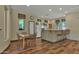 Cozy kitchen with breakfast bar, dining table, and wood-look floors providing both comfort and style at 3131 E Legacy Dr # 1057, Phoenix, AZ 85042