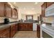 Well-equipped kitchen with dark wood cabinetry and countertops at 3131 E Legacy Dr # 1057, Phoenix, AZ 85042