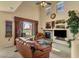 Bright living room with fireplace, high ceilings, and views of the golf course at 3131 E Legacy Dr # 1057, Phoenix, AZ 85042