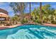 Sparkling community pool featuring a tranquil waterfall feature and lush landscaping at 3131 E Legacy Dr # 1057, Phoenix, AZ 85042