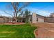 Inviting backyard featuring a brick patio and lush green lawn, great for outdoor gatherings at 3243 E Sheridan St, Phoenix, AZ 85008