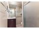 Bathroom with updated vanity, framed mirror, and glass-enclosed shower at 3243 E Sheridan St, Phoenix, AZ 85008