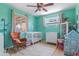 Well lit Bedroom with a ceiling fan, two windows, and comfortable furnishings at 3243 E Sheridan St, Phoenix, AZ 85008