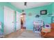 Vibrant Bedroom featuring a ceiling fan, closet, and views into the dining room at 3243 E Sheridan St, Phoenix, AZ 85008