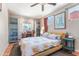 Bright bedroom with a large window, natural light and a ceiling fan at 3243 E Sheridan St, Phoenix, AZ 85008