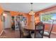 Dining room featuring hardwood floors, natural lighting, and vintage decor at 3243 E Sheridan St, Phoenix, AZ 85008