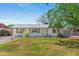 Charming single-story home featuring a well-maintained lawn and a freshly painted exterior at 3243 E Sheridan St, Phoenix, AZ 85008