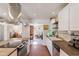 Modern kitchen with stainless steel appliances and a seamless transition to the living area at 3243 E Sheridan St, Phoenix, AZ 85008
