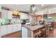 Updated kitchen with granite counters, island seating, and stainless-steel appliances at 3243 E Sheridan St, Phoenix, AZ 85008