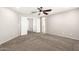 Bedroom with ceiling fan, neutral walls, walk in closets and plush carpeting at 34949 N Spur Cir, San Tan Valley, AZ 85144