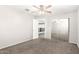 Bedroom featuring carpeted floor, ceiling fan, and walk-in closet at 34949 N Spur Cir, San Tan Valley, AZ 85144