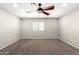 Bedroom with ceiling fan, neutral walls, and window with blinds and wall-to-wall carpeting at 34949 N Spur Cir, San Tan Valley, AZ 85144