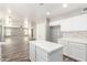 Open kitchen with seamless flow to the living room and dining area, perfect for entertaining at 34949 N Spur Cir, San Tan Valley, AZ 85144
