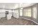 Eat-in kitchen with stainless steel appliances, white cabinets, and natural light at 34949 N Spur Cir, San Tan Valley, AZ 85144