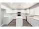Well-lit kitchen with stainless steel appliances, island, and tiled backsplash at 34949 N Spur Cir, San Tan Valley, AZ 85144
