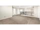 Loft space with neutral walls, plush carpet, and modern railing at 34949 N Spur Cir, San Tan Valley, AZ 85144