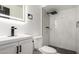 Bathroom with modern fixtures, white vanity, and glass enclosed shower at 3802 N 48Th Dr, Phoenix, AZ 85031