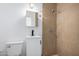 Modern bathroom with tile shower, toilet, vanity, and sink at 3802 N 48Th Dr, Phoenix, AZ 85031