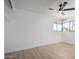 Bedroom with light-toned wood look floors, ceiling fan, and window at 3802 N 48Th Dr, Phoenix, AZ 85031