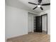 Bedroom with light-toned wood look floors, ceiling fan, built in closet at 3802 N 48Th Dr, Phoenix, AZ 85031