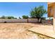 Spacious backyard enclosed by a block wall, with a small tree at 4636 W Mission Ln, Glendale, AZ 85302