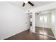 Bedroom with closet doors, wood-look tile flooring, and neutral paint, provides ample space and lots of light at 4636 W Mission Ln, Glendale, AZ 85302