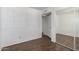Bedroom with closet doors, wood-look tile flooring, and neutral paint, provides ample space and lots of light at 4636 W Mission Ln, Glendale, AZ 85302
