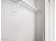 Clean closet offers lots of potential for storage with closet rod for hanging clothes and neutral paint at 4636 W Mission Ln, Glendale, AZ 85302