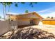 Exterior view of a home with a covered patio and desert landscaping at 4636 W Mission Ln, Glendale, AZ 85302