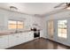 Bright kitchen with stainless steel appliances, wood countertops, and white cabinets at 4636 W Mission Ln, Glendale, AZ 85302