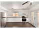 Bright kitchen with stainless steel appliances, wood countertops, and white cabinets at 4636 W Mission Ln, Glendale, AZ 85302