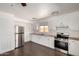 The kitchen features stainless steel appliances, wood countertops, and crisp white cabinets at 4636 W Mission Ln, Glendale, AZ 85302