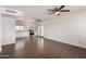 Bright living room with modern flooring, neutral walls, and ceiling fans at 4636 W Mission Ln, Glendale, AZ 85302