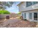 Cozy backyard with brick patio, block wall and access from the home's double doors at 4813 W Belmont Ave, Glendale, AZ 85301