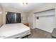 Bedroom with neutral walls and carpet, empty closet and bed frame at 4813 W Belmont Ave, Glendale, AZ 85301